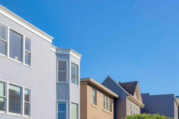 Exterior of houses in San Francisco, California against clear blue sky
