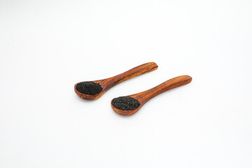 Nigella or black cumin with medicinal tulsi seeds on white background