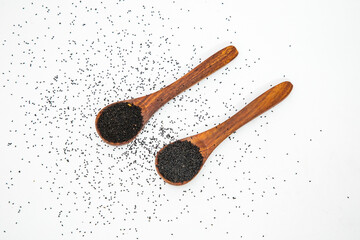 Nigella or black cumin with medicinal tulsi seeds on white background