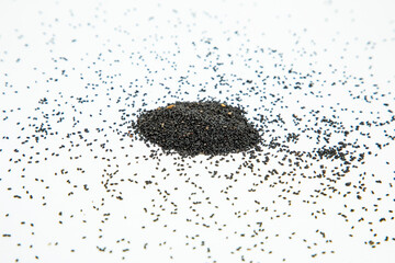 Nigella or black cumin with medicinal tulsi seeds on white background