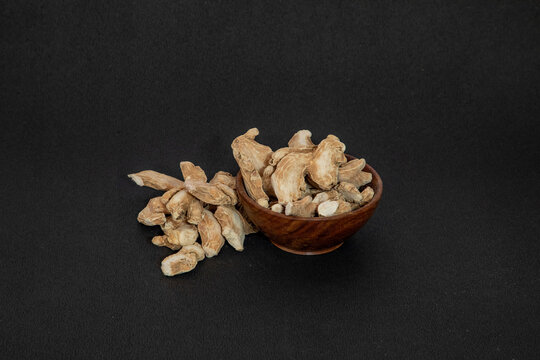Organic ayurvedic whole dry ginger or sonth adrak on black background
