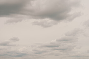 White clouds over clody sky