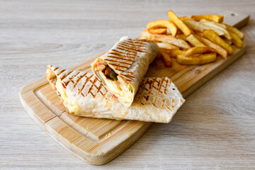 Lavash doner kebab ( zurna doner durum )  or shawarma sliced in plate isolated. 