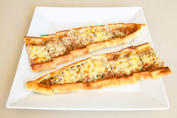 Kiymali pide. Turkish pide with minced meat. Turkish pizza mince pita Pide on white background. Etli ekmek. Kusbasi kasarli, kiymali kasarli, kiymali yumurtali, Bafra, Trabzon, Kusbasili pide.
