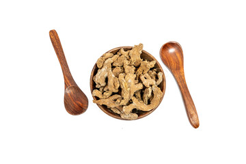 Dry ginger slices or zingiber officinale in bowl isolated on white background
