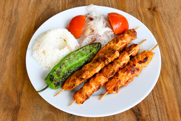 Chicken wings barbeque in a dish with BBQ grill sauce . Izgara tavuk kelebek sis kanat. Tavuk sis, gogus.