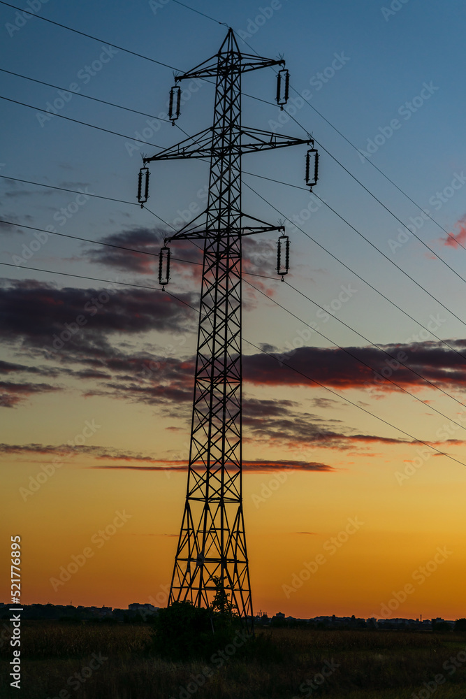 Wall mural detail of electric pole with electric cables at sunset