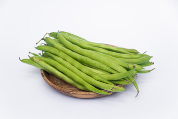 Organic Fresh raw string bean or french beans or Phaseolus vulgaris or common bean on white background.