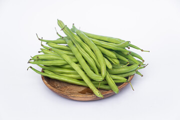Organic Fresh raw string beans or french beans or Phaseolus vulgaris or common bean on white background.