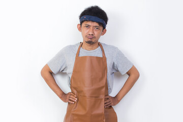 portrait mad tired asian man barista waitress isolated on white background
