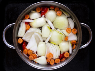 Saucepan with chopped vegetables for soup