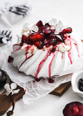 dessert Pavlova cake with cherry plum