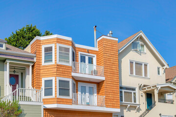 Facade of houses with balconies and stairs at the front doors in San Francisco, California
