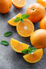 Fresh ripe oranges on concrete background