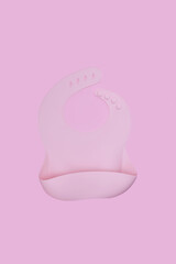 Pink silicone bib on pink background