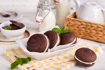 Whoopie pies. Chocolate sandwich cookies with cream filling. Delicious American homemade cakes.