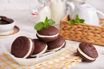 Whoopie pies. Chocolate sandwich cookies with cream filling. Delicious American homemade cakes.
