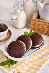 Whoopie pies. Chocolate sandwich cookies with cream filling. Delicious American homemade cakes.
