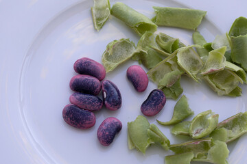 RUNNER BEANS GREEN PODS ON WHITE PLATE 