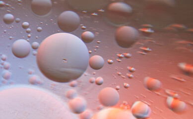 Macro view of mixed oil and water. Abstract model of the atom of a molecule. Universe cosmic abstract blur background.