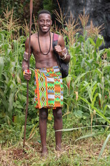 Education in Africa,farming,agriculture: A barefoot young African Masai Moran warrior student...