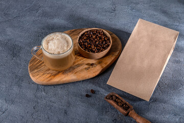 Coffee identity branding mockup. Blank brown craft bag with coffee beans and cup of coffee. Package mockup template for logo, brand, sticker, label. Top view, flat lay