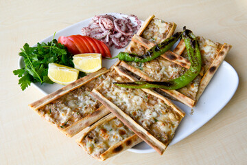 Kiymali pide. Turkish pide with minced meat. Turkish pizza mince pita Pide on white background. Etli ekmek. Kusbasi kasarli pide.