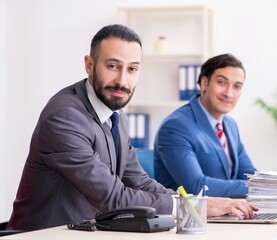Two male colleagues in the office
