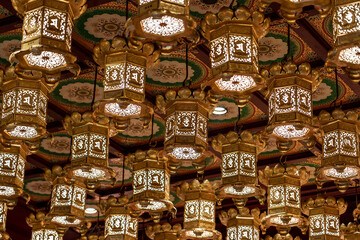 Chinese gold lanterns in temple in Singapore. Interior decorations and lanterns at Buddha Tooth...