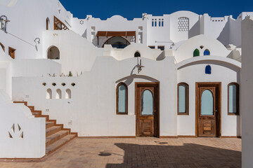 Detail of stairs and white wall of a house on the street of Egypt in Sharm El Sheikh