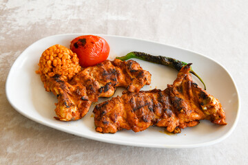 Chicken wings barbeque in a dish with BBQ grill sauce . Izgara tavuk kelebek sis kanat. Tavuk sis, gogus.