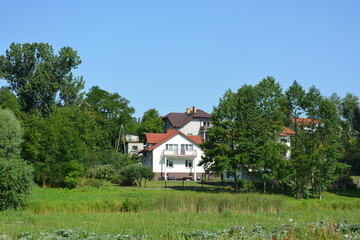 Bright, doll-like, stylish houses, private buildings are located around the amazing nature, the Bug River in the village of Ribenko-Nova of Gmina Wyszków, Masovian Voivodeship, in east-central Poland.