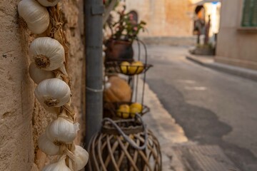 Close-up of some garlic displayed on the street