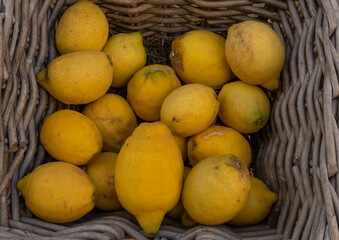 Lemons in a wicker basket on the street