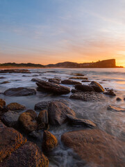 Sunrise view along the rocky shore at Avalon, Sydney, Australia.