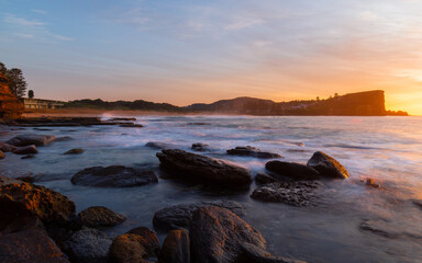 Sunrise view along the rocky shore at Avalon, Sydney, Australia.