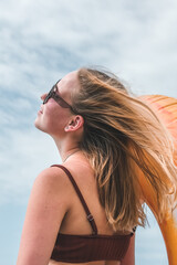 Travel.Traveler girl resting on the beach near the sea. Eco travel, taking care of yourself physical and mental health. Slow life and sea holidays. work and leisure travel. Traveling outdoor