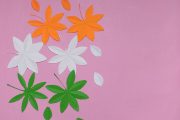 Indian tricolour paper cut leaves on pink background. Conceptual image for Indian national day...