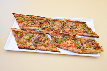 Kiymali pide. Turkish pide with minced meat. Turkish pizza mince pita Pide on white background. Etli ekmek. Kusbasi kasarli pide.