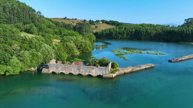 Marsh in the surroundings of the Castellanos tide mill. Aerial view from drone. Campiazo river. Ria de Ajo or Castellanos. Municipality of Arnuero. Cantabrian Sea, Cantabria, Spain, Europe