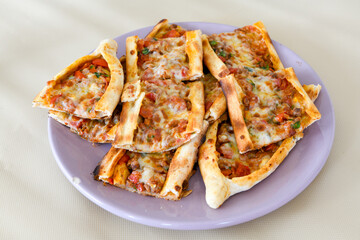 Kiymali pide. Turkish pide with minced meat. Turkish pizza mince pita Pide on white background. Etli ekmek. Kusbasi kasarli pide.