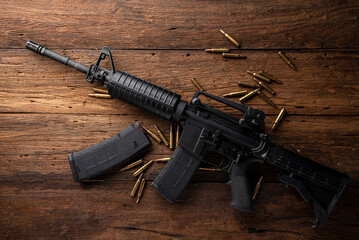 Gun with ammunition on  background.  - obrazy, fototapety, plakaty