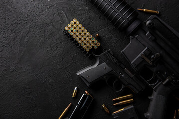 Gun with ammunition on table background. 