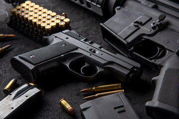 Gun with ammunition on table background. 