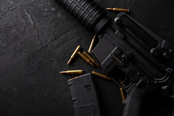 Gun with ammunition on table background. 