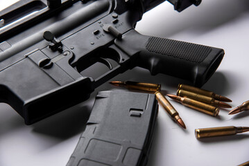 Gun with ammunition on table background. 