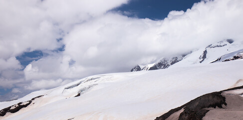 Panorama of a colored mountain landscape with the snow covered mountains - 521811646