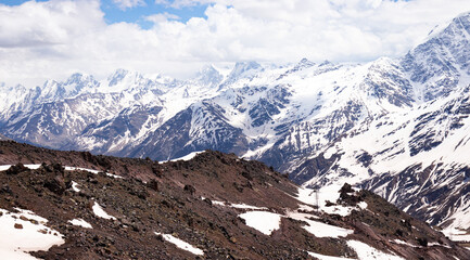 Panorama of a colored mountain landscape with the snow covered mountains - 521812026