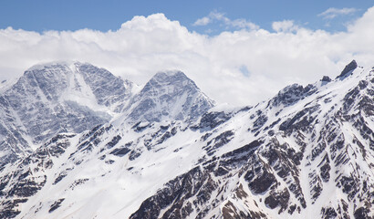 Panorama of a colored mountain landscape with the snow covered mountains - 521812220