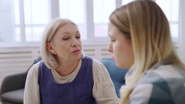 Closeup of mother supporting her upset daughter, friendship with mom, parenting